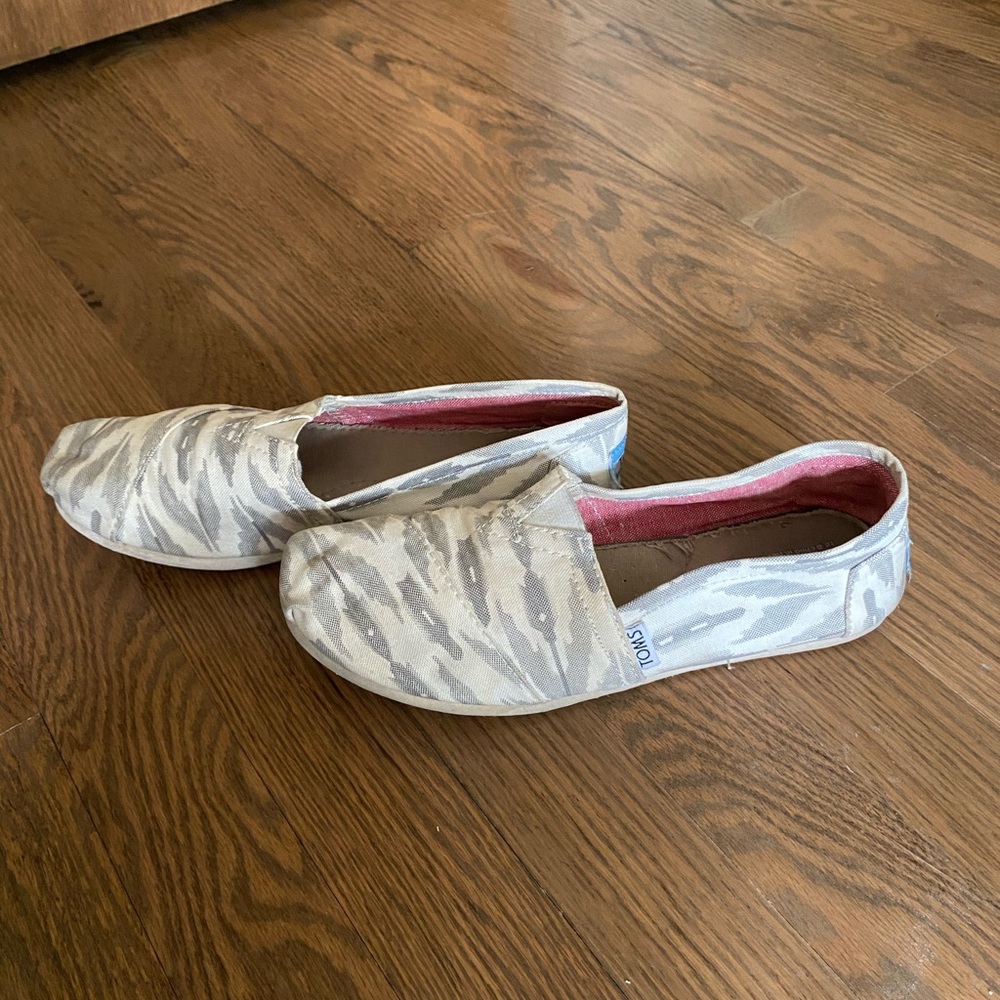 Gray and cream Toms slip ons